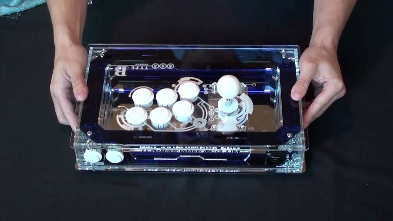 A fightstick in an acrylic enclosure.